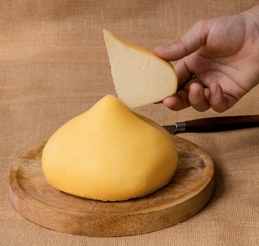 Tetilla cheese cut